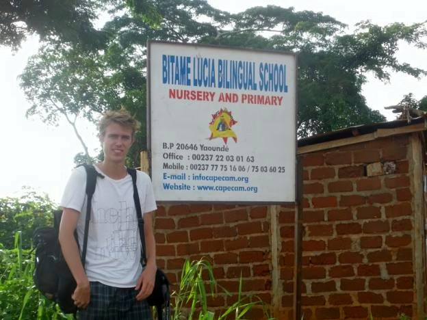 File:Volunteer near informational board.jpg