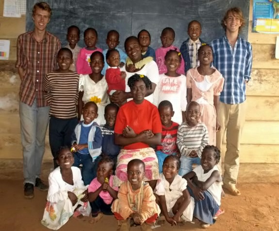 File:Kids with teachers near blackboard.jpg