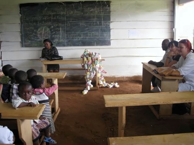 File:Kids with teacher and sponsors in classroom.jpg